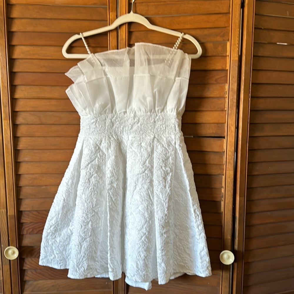 White evening dress with pearl straps